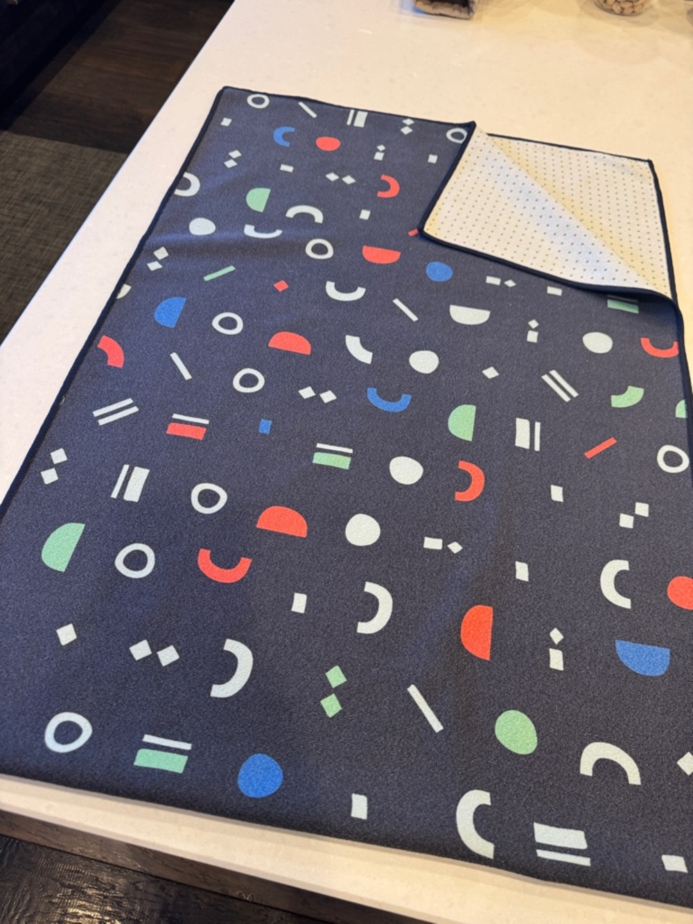 Yogurt’s yoga mat towelNavy Geometric Bath Mat with Multicolor Shapes